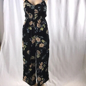 Xhilaration floral pants romper size extra small  has a small rip New With Tags